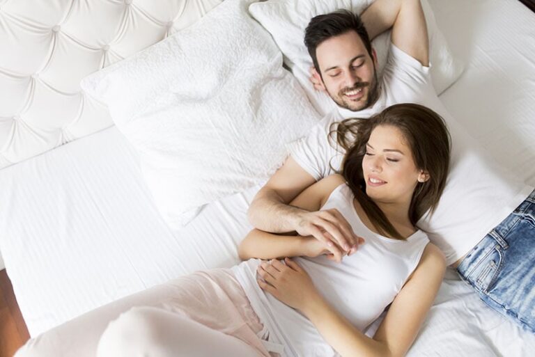 couple lying on bed