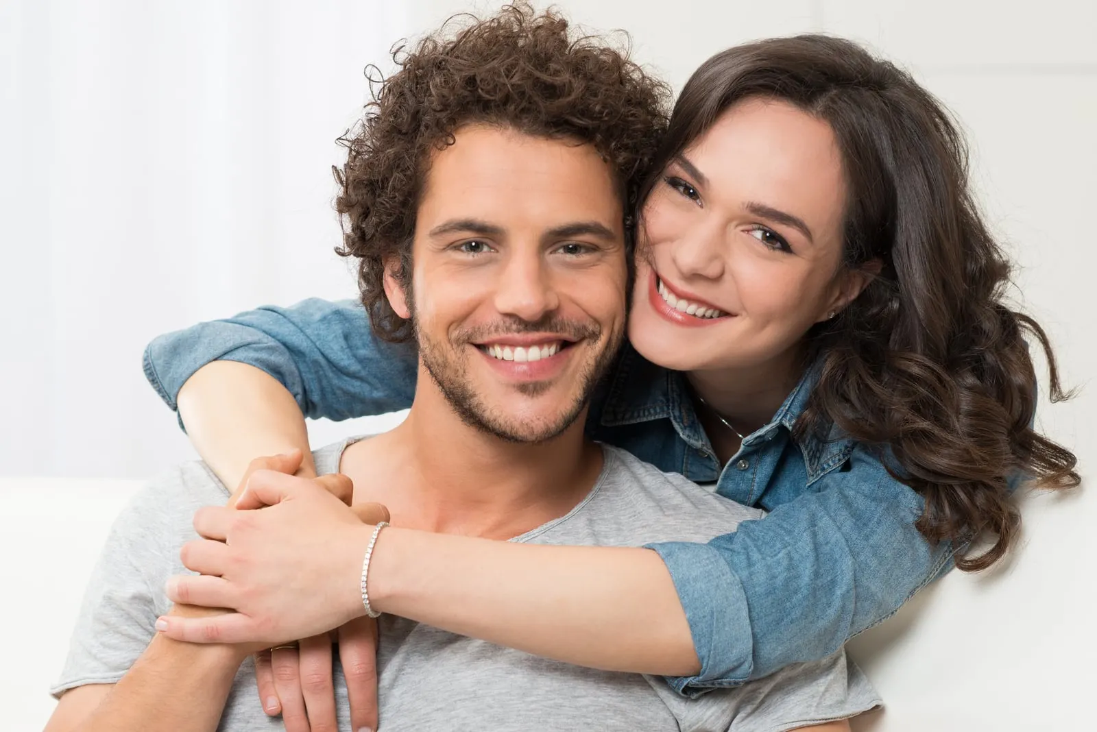 portrait of young smiling man and woman