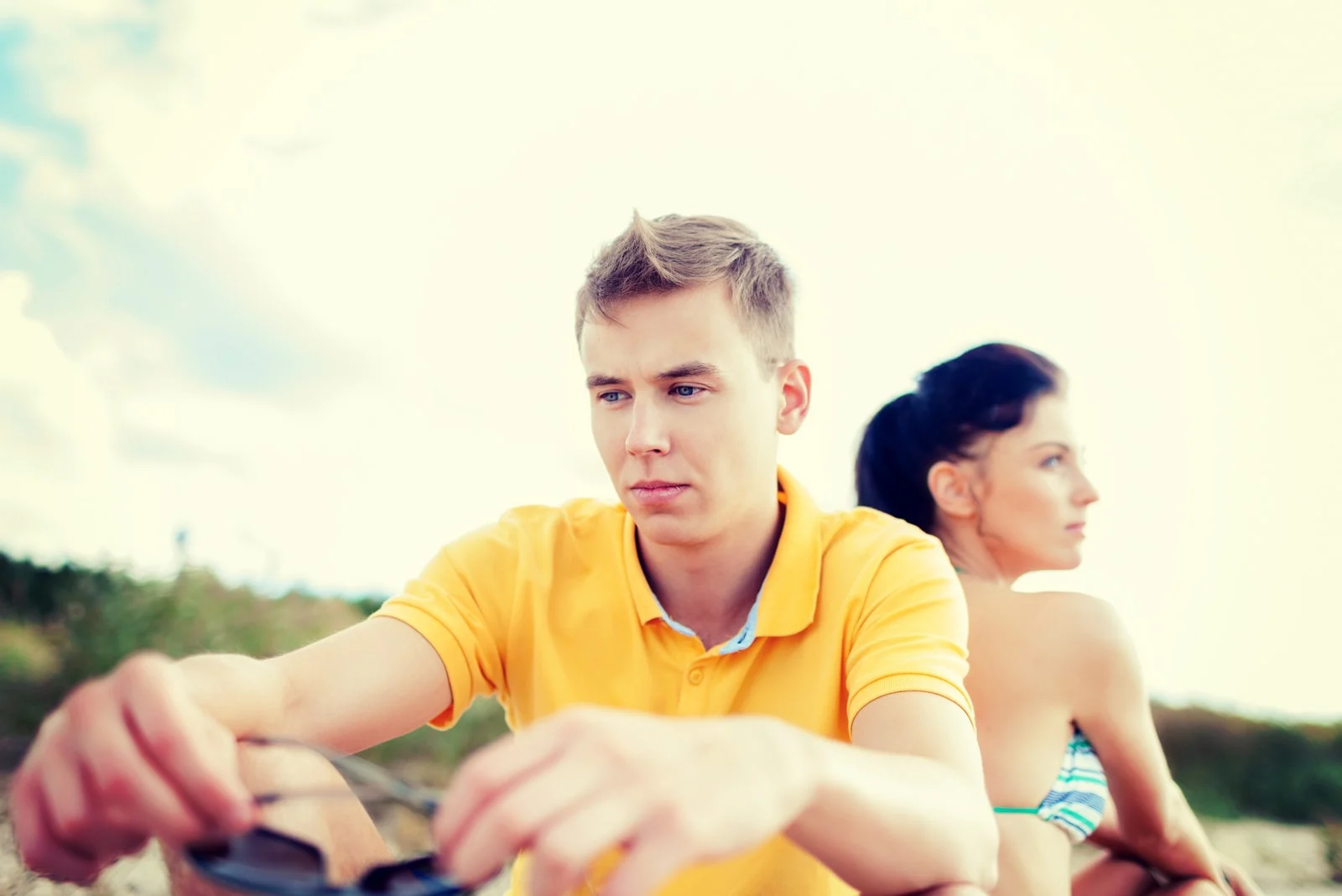 upset couple sitting outside