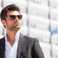 gorgeous stylish man wearing sunglasses