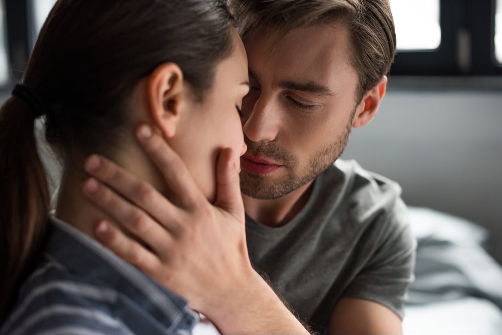 man and woman tenderly embracing