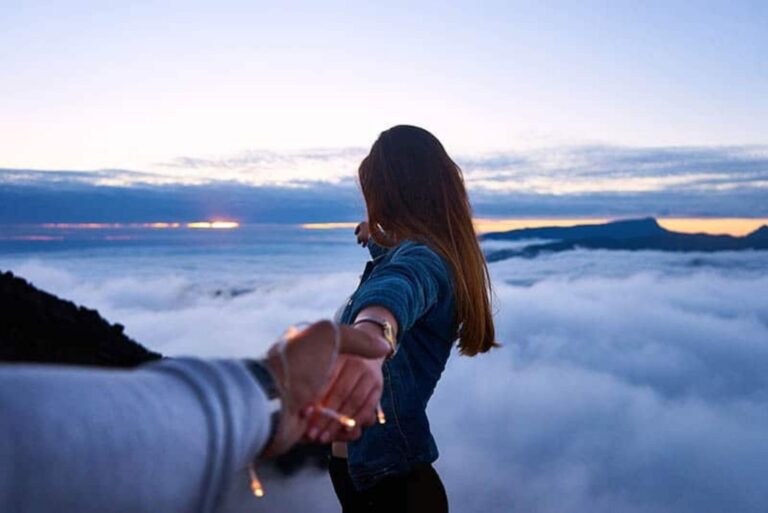 a man and a woman holding hands