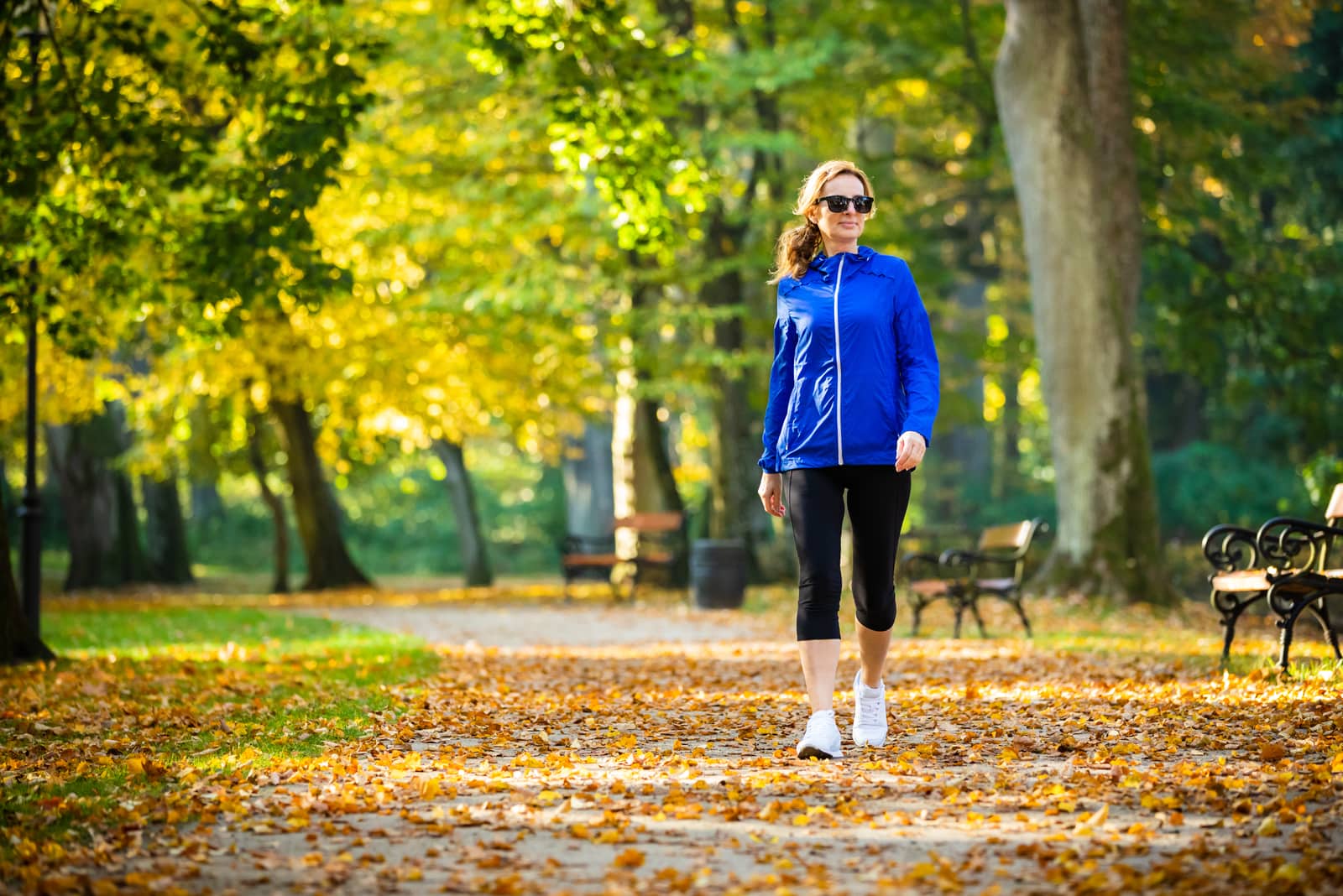 a woman sets in a tracksuit