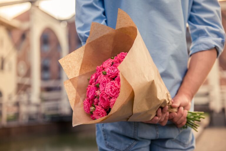 man holding flowers