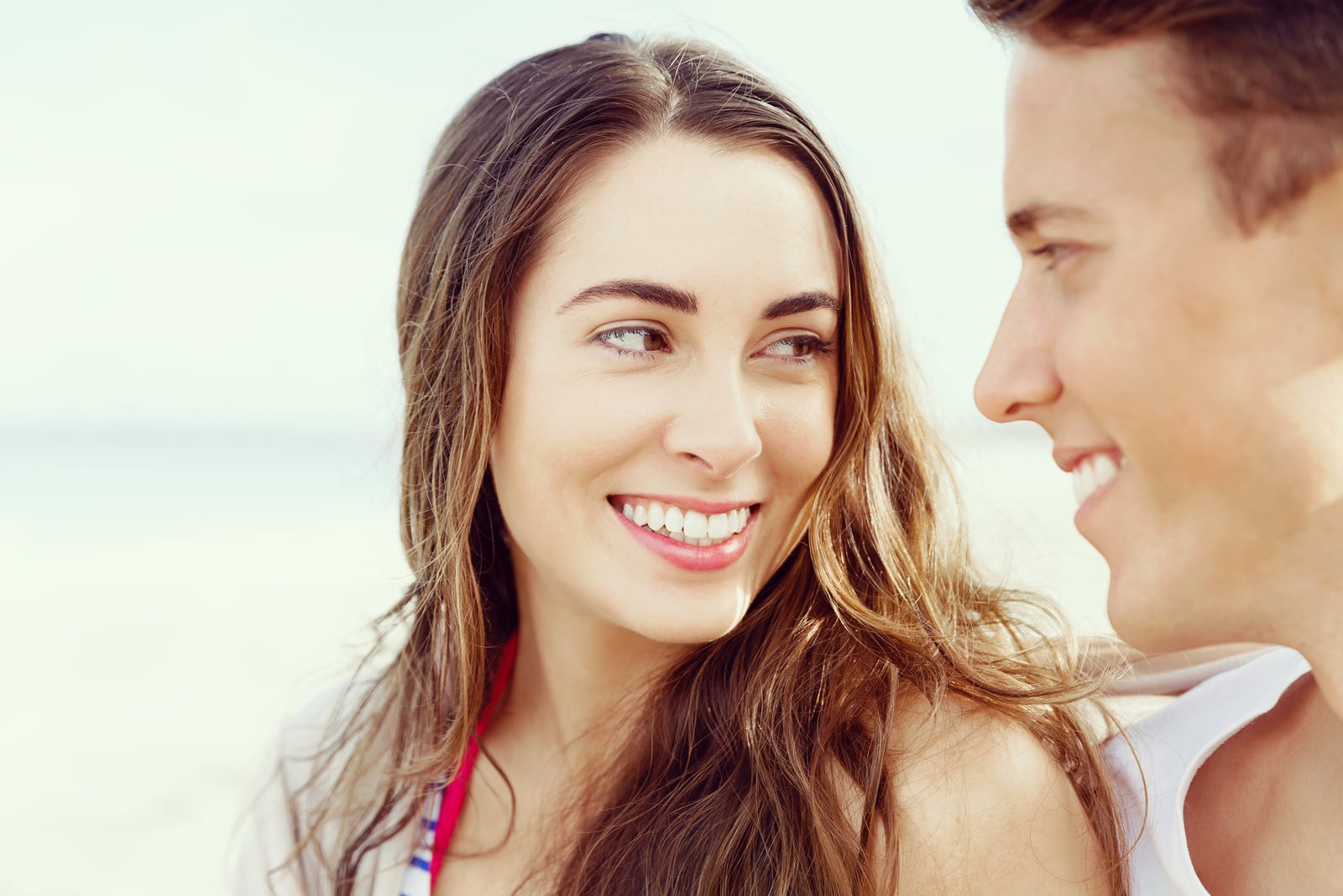 Romantic young couple looking each other