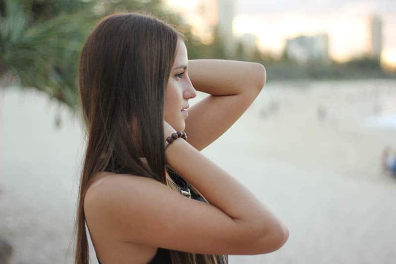side view of woman standing outside