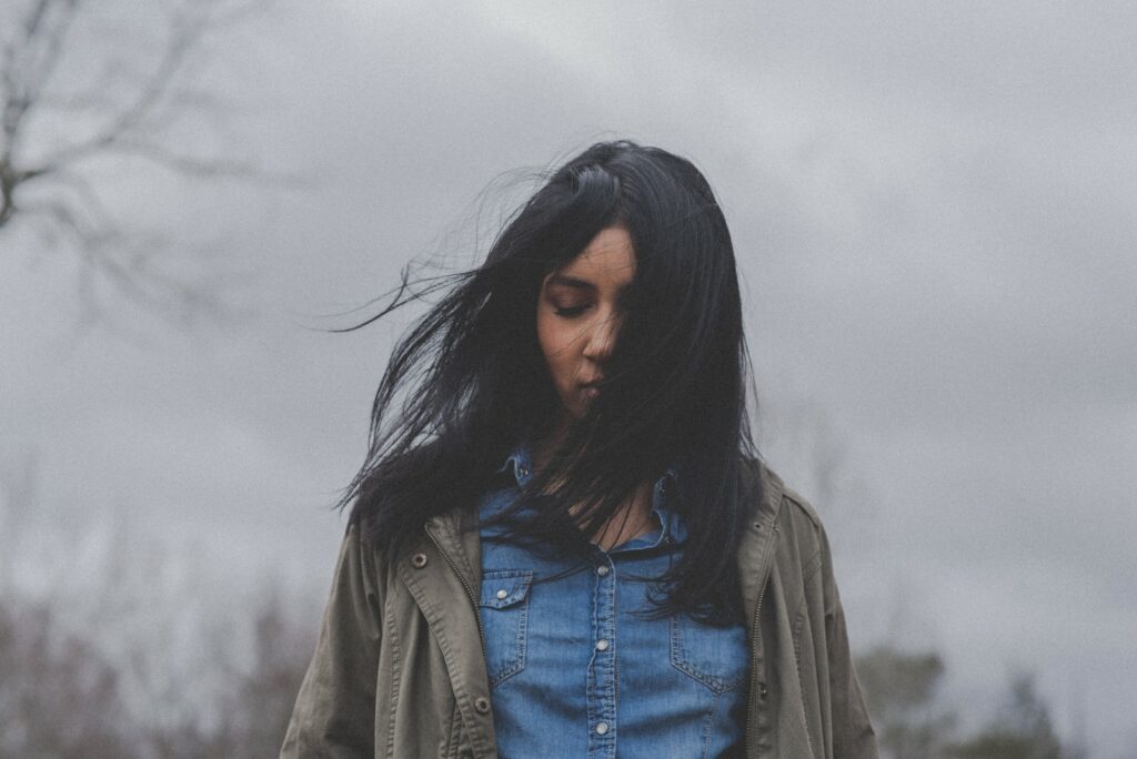 a girl whose hair is swaying in the wind