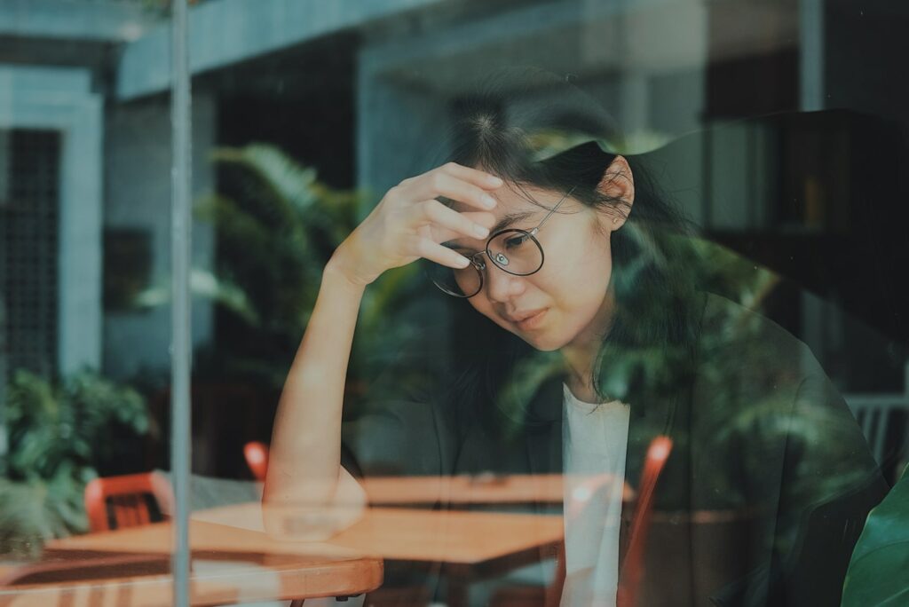 a sad girl sitting alone