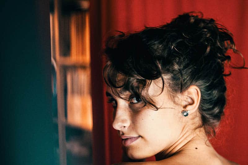 close up portrait of woman looking back