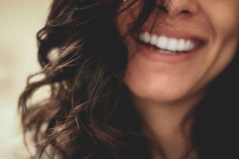long black haired woman smiling