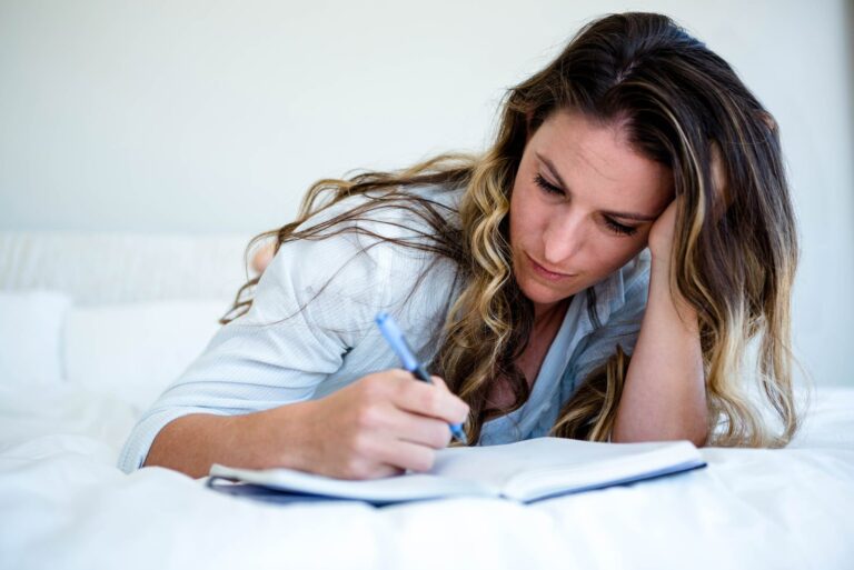 the woman sits and writes