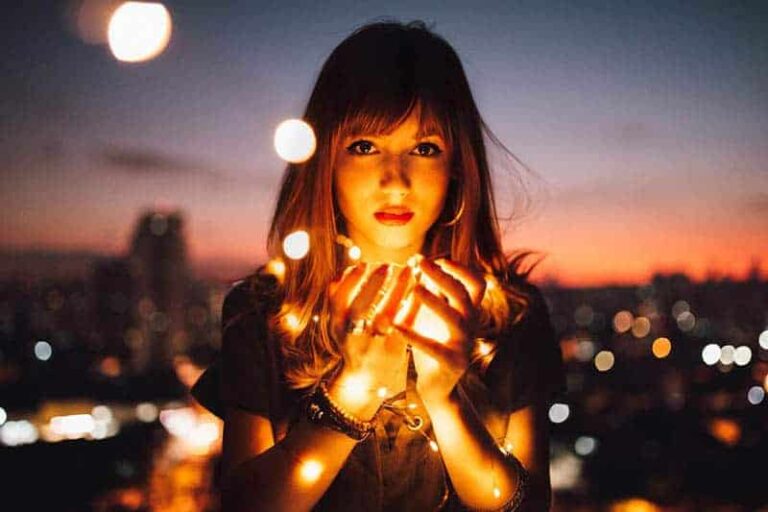 woman holding a lights