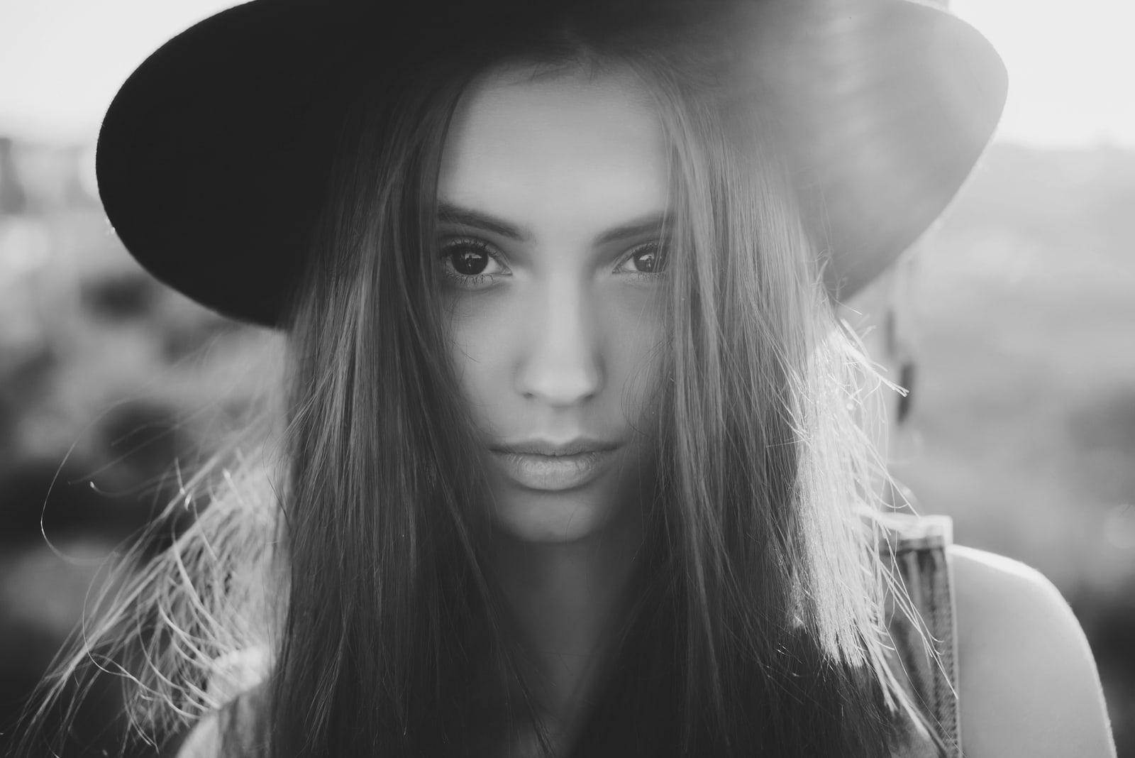 beautiful young girl in a black hat