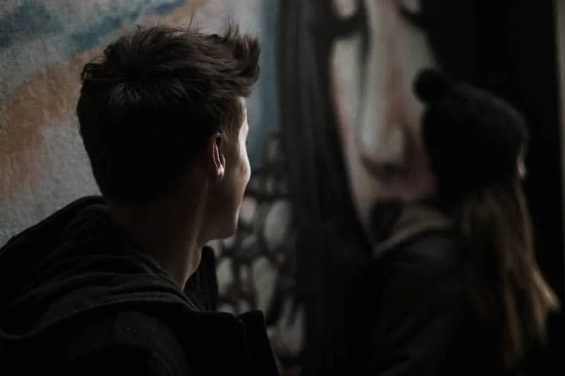 man looking at woman