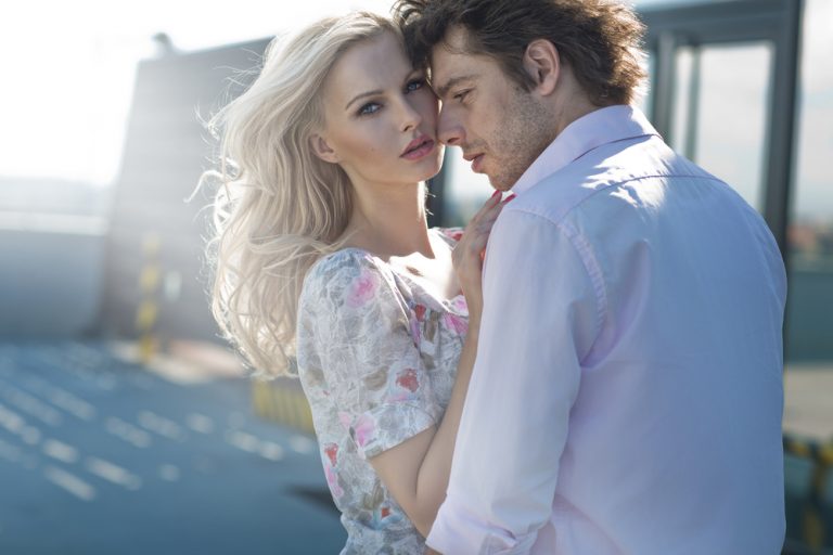 a woman in the arms of a man
