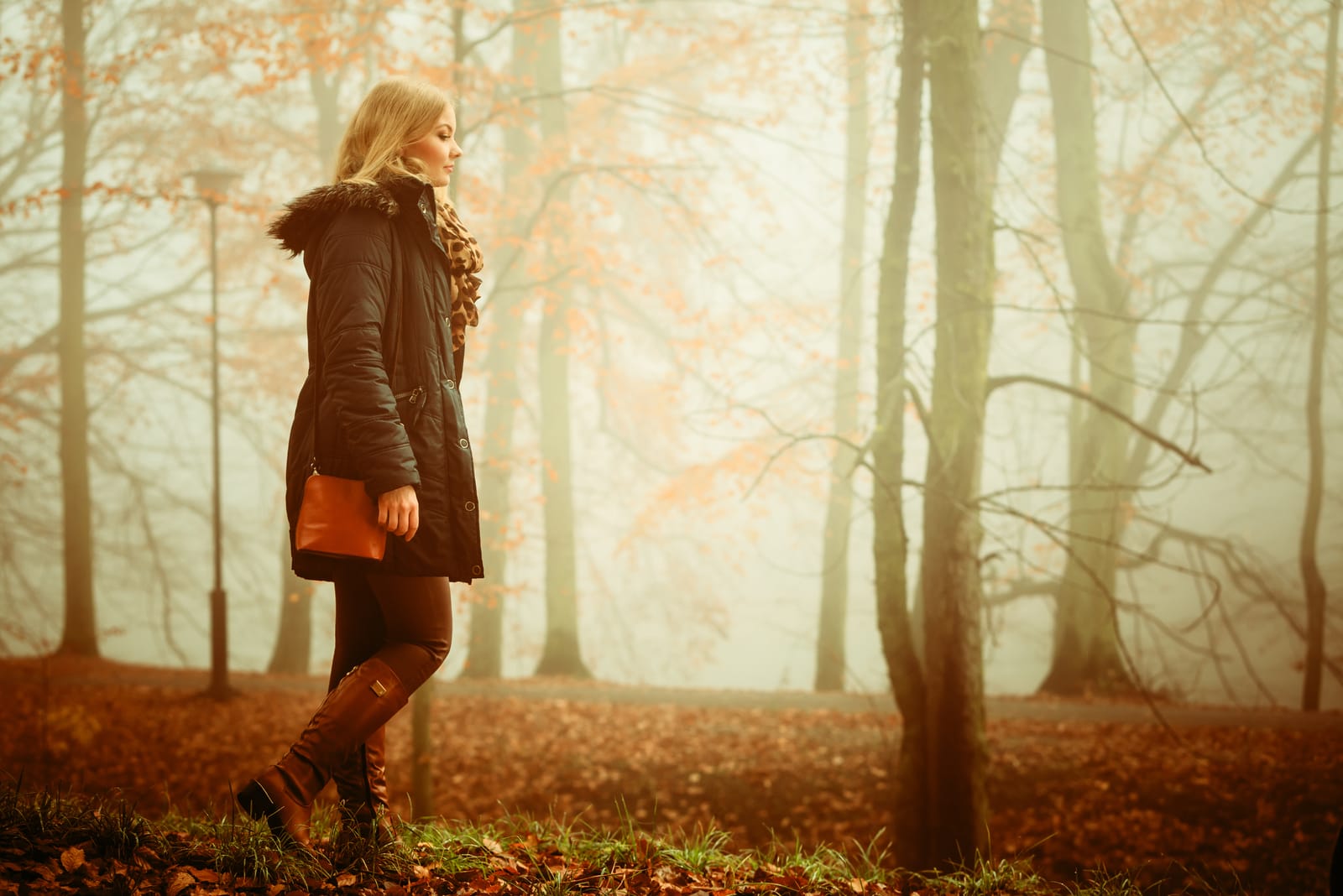 lonely woman walking in park