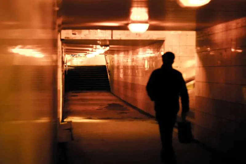 man walking through the subway
