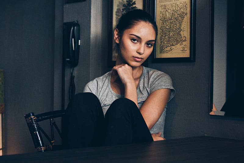 portrait of woman sitting at home