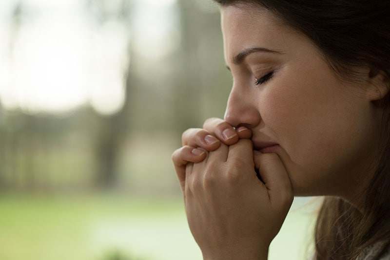 young woman crying in silence