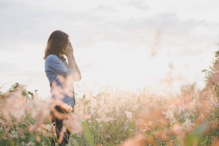 side view of sad woman in field