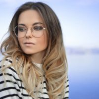 beautiful woman with glasses looking away