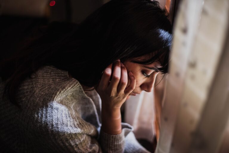 pensive woman with her head down