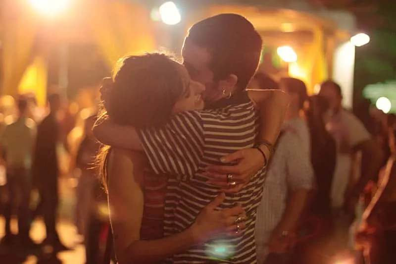 Couple hugging at a party