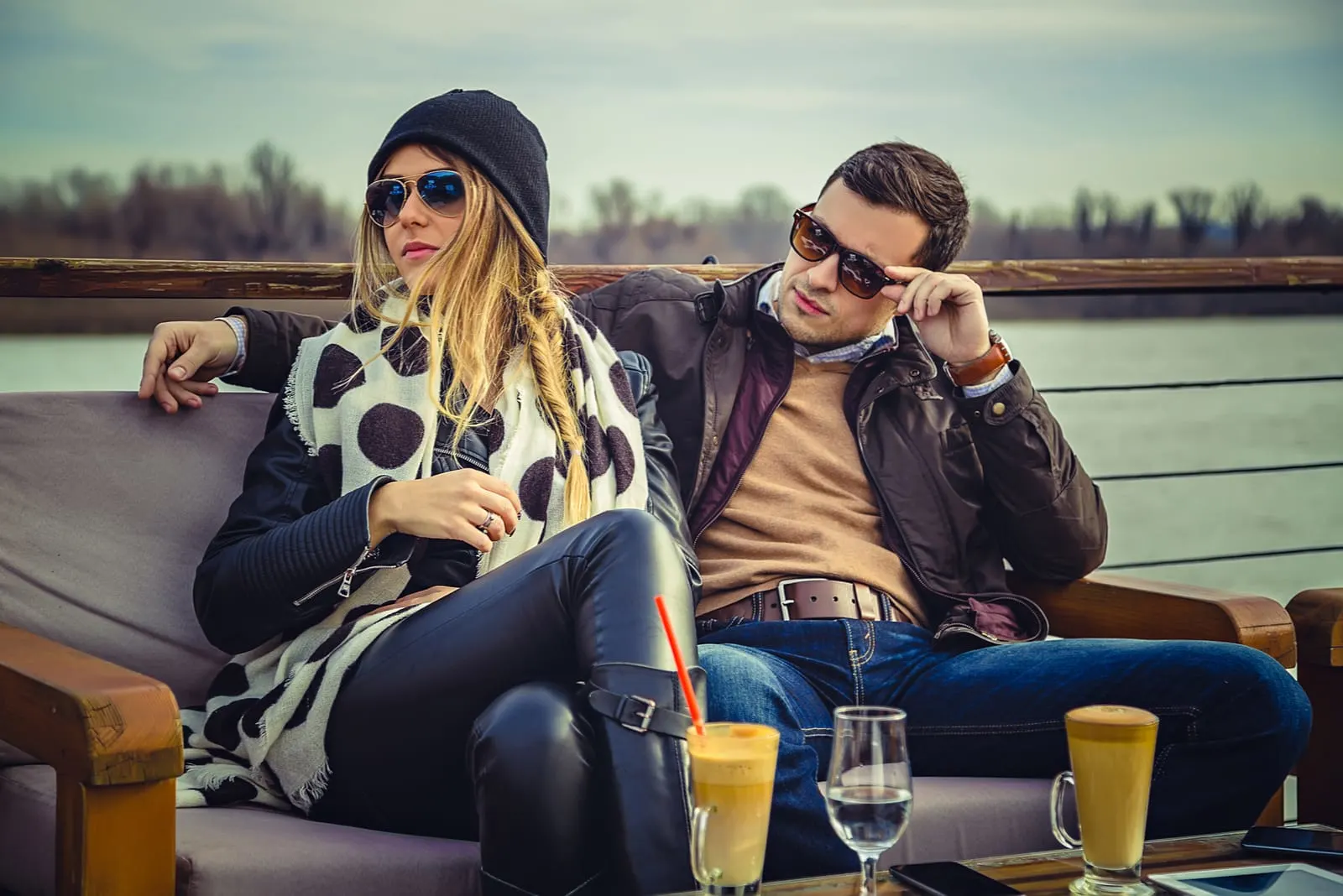 man and woman sitting drinking coffee