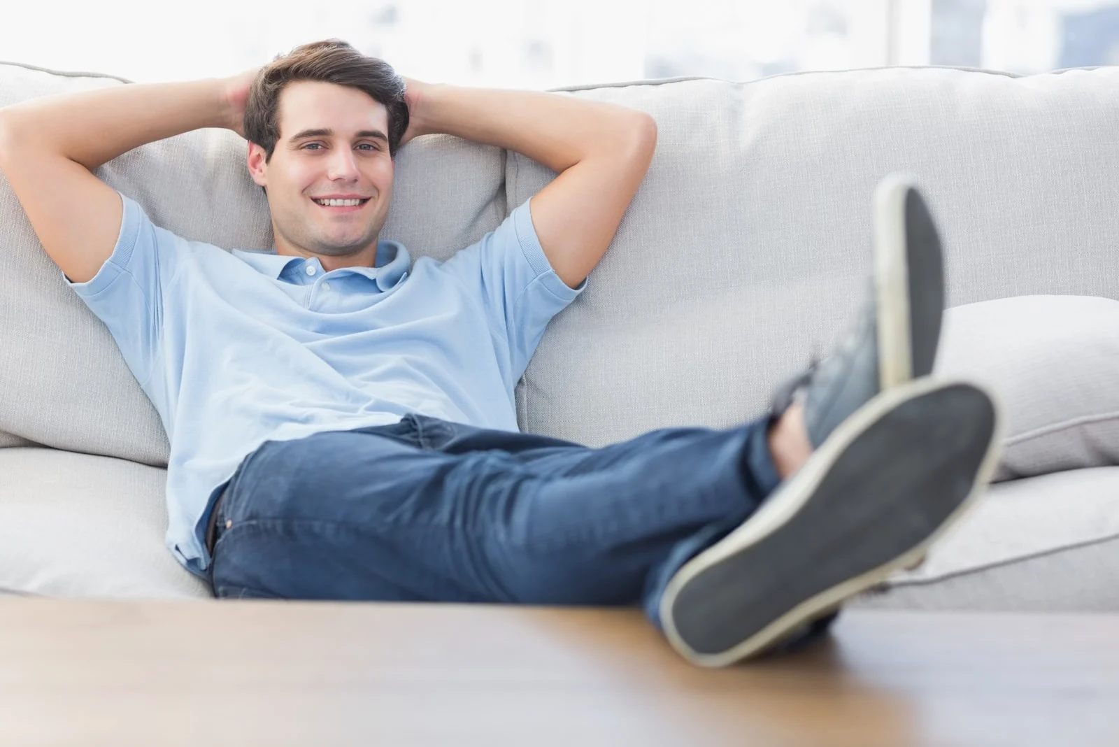 relaxed man sitting on couch
