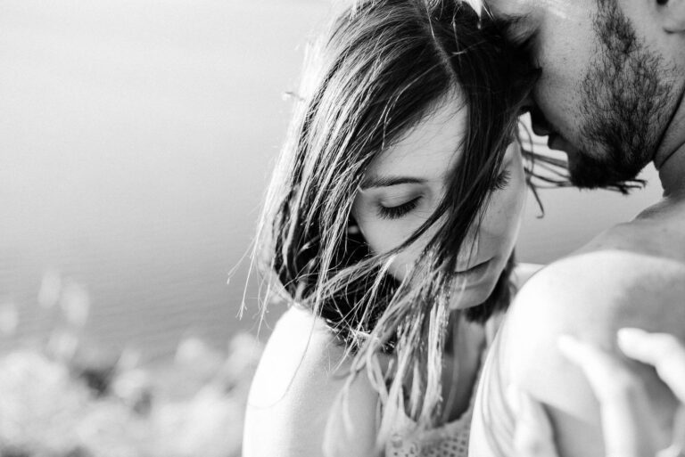 young couple hugging with closed eyes