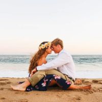 lovely couple sitting on the beach