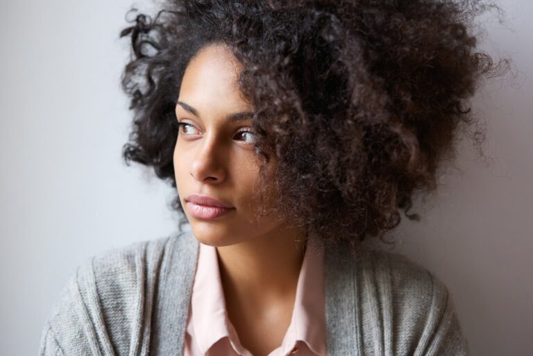 an attractive black woman thinks