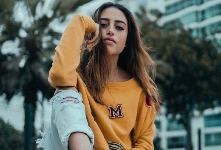 woman wearing yellow sweatshirt