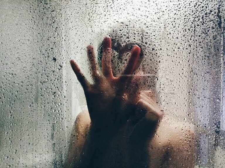 close up photo of woman hand on wet glass