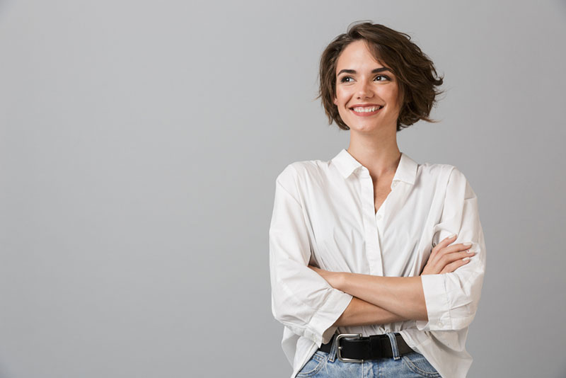 confident woman in white shirt posing