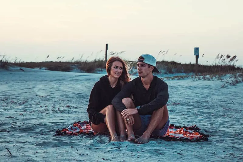 couple at the beach sitting