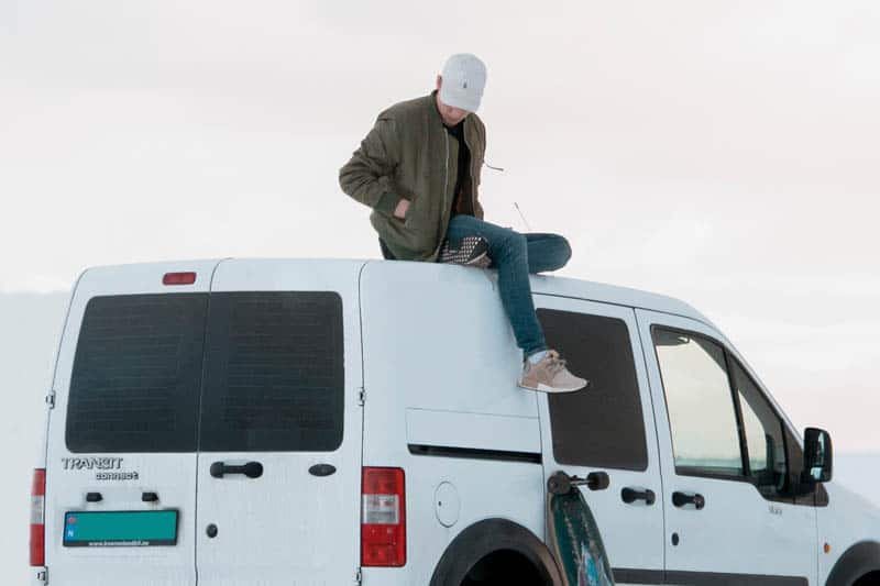 skateboard man sitting on van