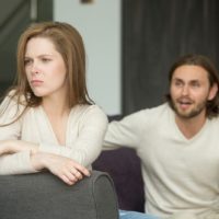 man trying to talk with woman