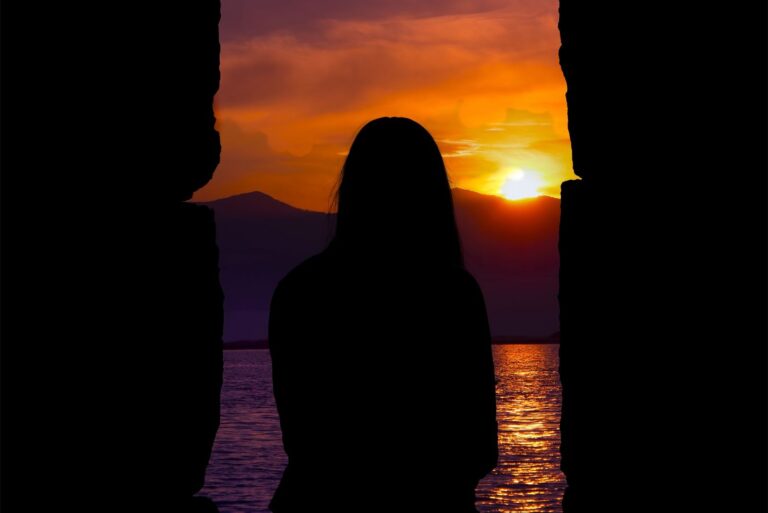 a lonely girl at sunset