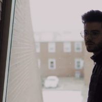thoughtful man wearing eyeglasses