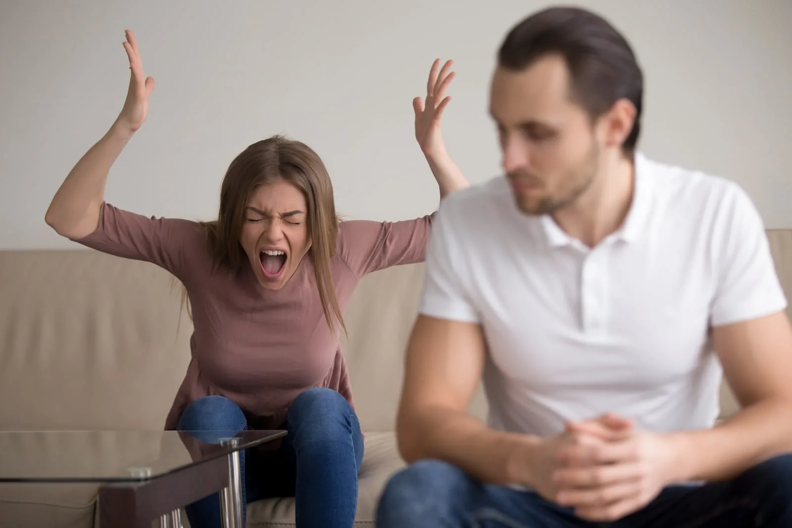 Young woman yelling at boyfriend in hysterics
