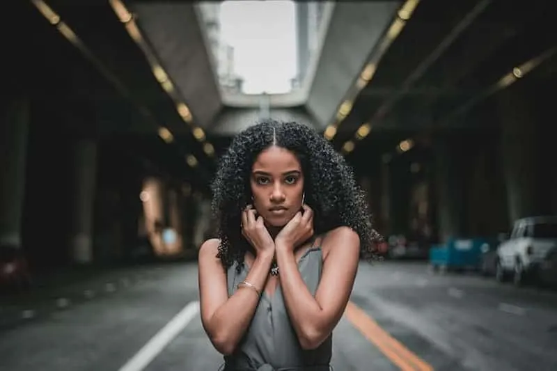 a woman touching her neck