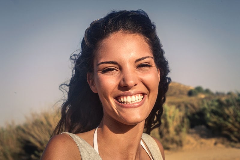 young woman smiling to camera