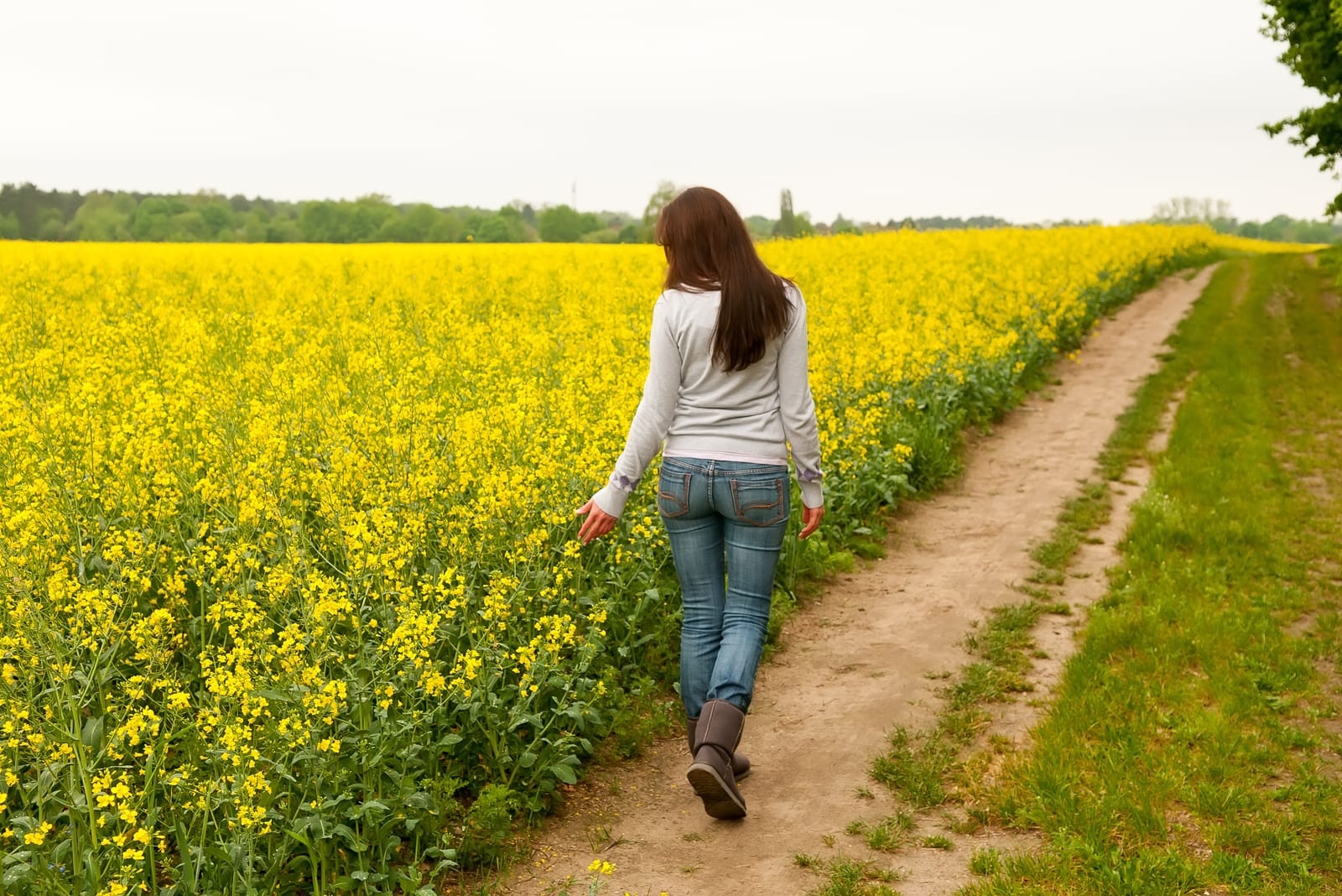 young woman walking on field