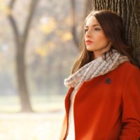 beautiful brunette woman in autumn park