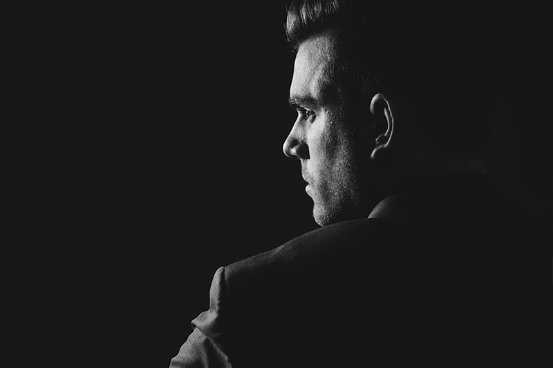 black and white photo of thoughtful man