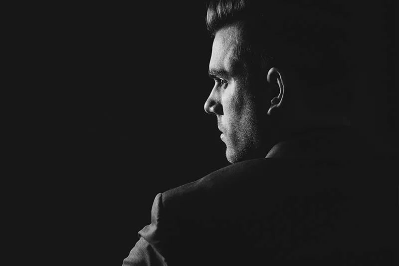 black and white photo of thoughtful man