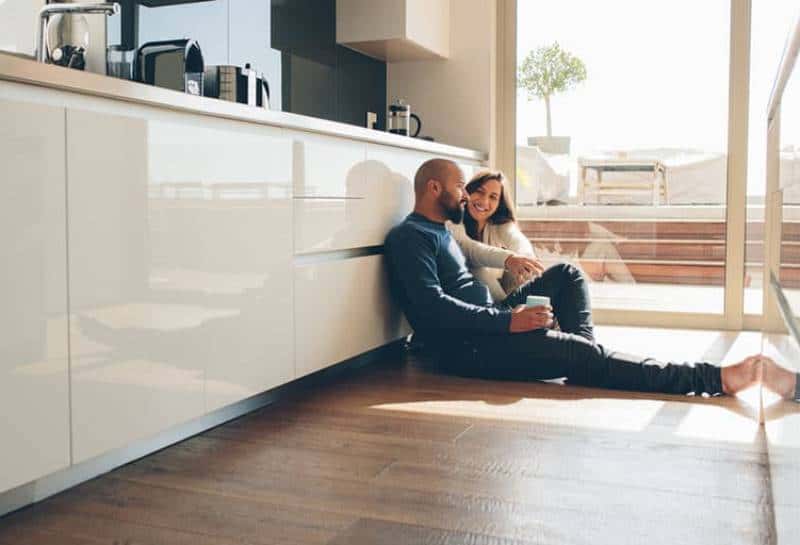 couple sitting in the kitchen at home