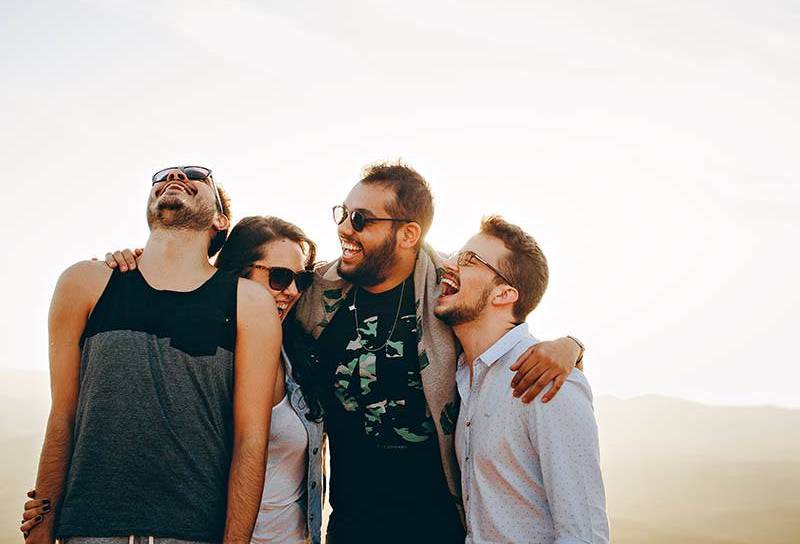 group of friends laughing outside