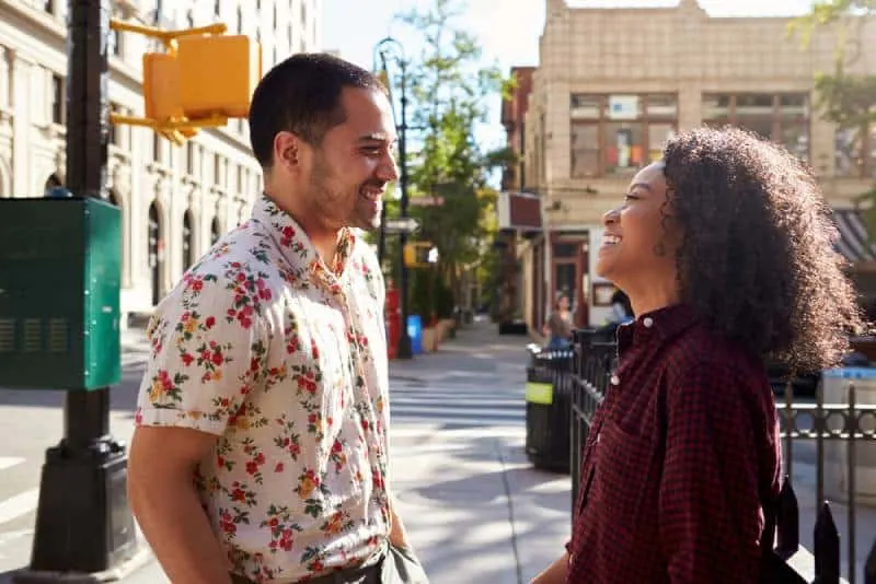 man and woman meeting on street